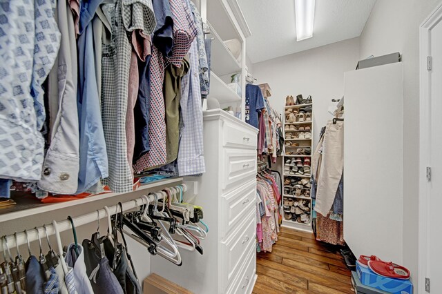 spacious closet with wood finished floors