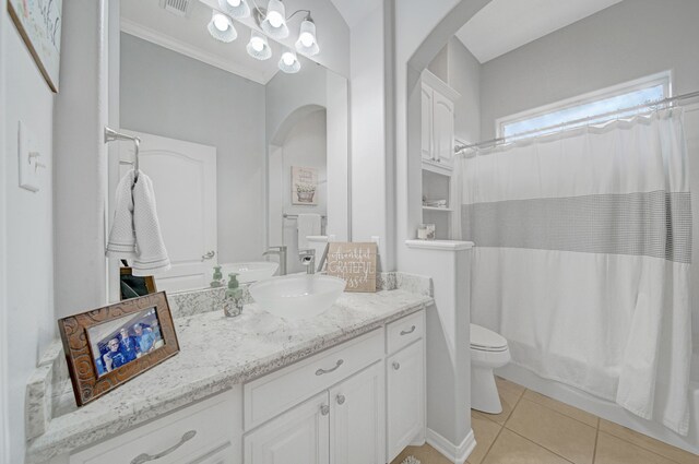 full bathroom with vanity, toilet, tile patterned floors, shower / bathtub combination with curtain, and visible vents