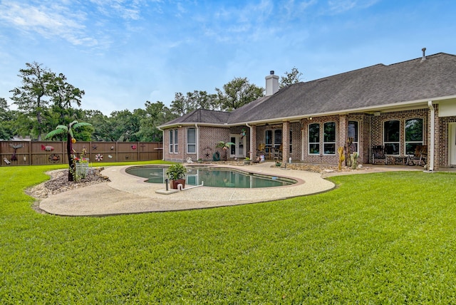view of swimming pool with a fenced in pool, a fenced backyard, a patio area, and a yard