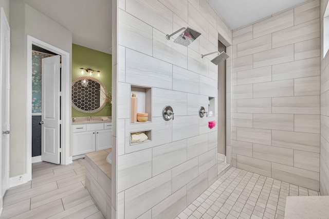 full bath with a walk in shower and vanity