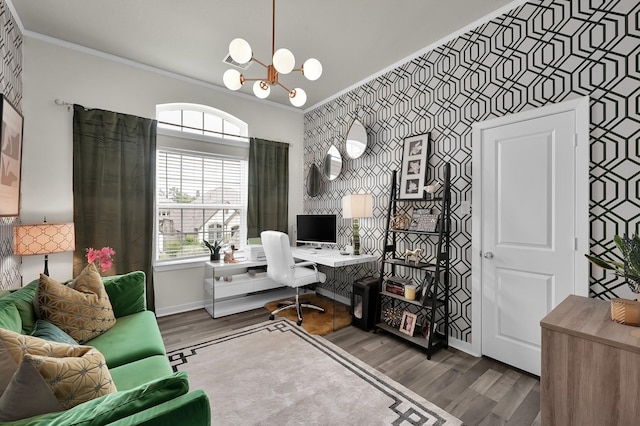 office area featuring an accent wall, wallpapered walls, and wood finished floors