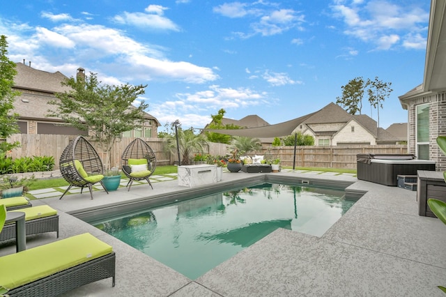 view of pool with a patio, a fenced backyard, and a hot tub