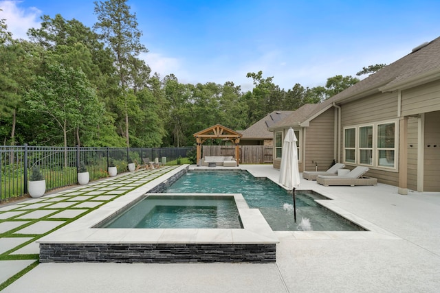 view of pool featuring a gazebo, a fenced backyard, an in ground hot tub, and a patio
