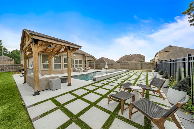 back of house featuring outdoor lounge area, a patio, a fenced in pool, and a fenced backyard