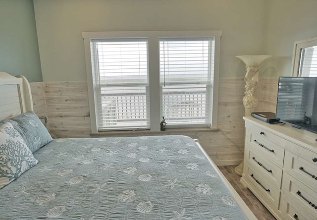 517 Private Road 675, Sargent, TX 77414 - bedroom with wainscoting, multiple windows, and tile walls