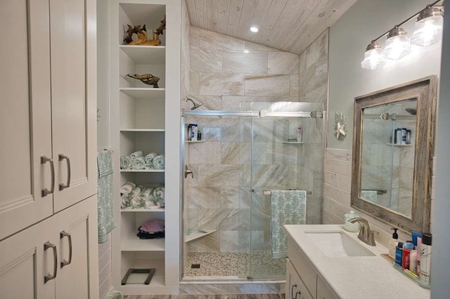 517 Private Road 675, Sargent, TX 77414 - bathroom with wood ceiling, tile walls, a stall shower, built in shelves, and vanity