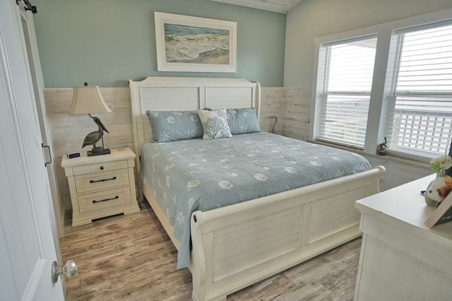 517 Private Road 675, Sargent, TX 77414 - bedroom featuring multiple windows and light wood finished floors