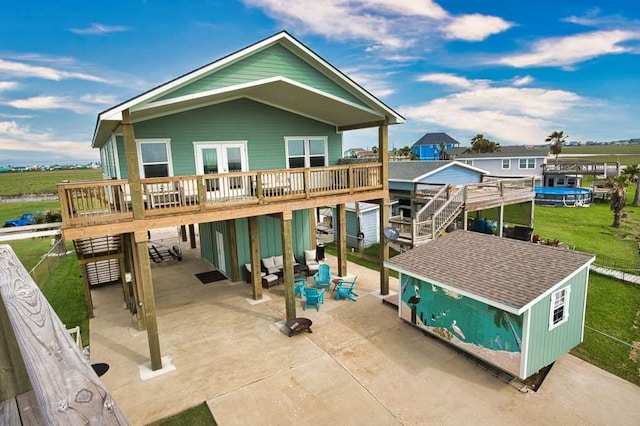 517 Private Road 675, Sargent, TX 77414 - rear view of house with a yard, a patio, and a wooden deck
