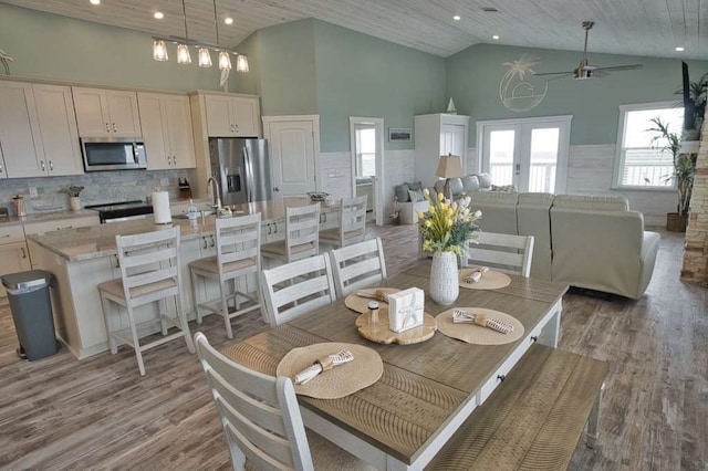 517 Private Road 675, Sargent, TX 77414 - dining room featuring light wood-type flooring, recessed lighting, ceiling fan, and high vaulted ceiling