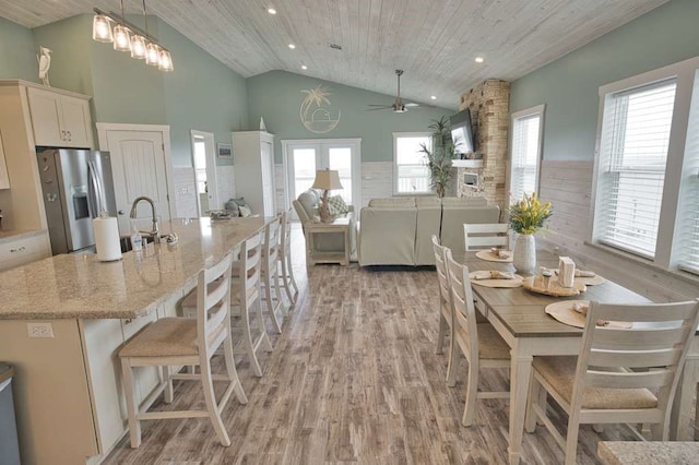 517 Private Road 675, Sargent, TX 77414 - dining room with light wood-style floors, ceiling fan, and a wealth of natural light