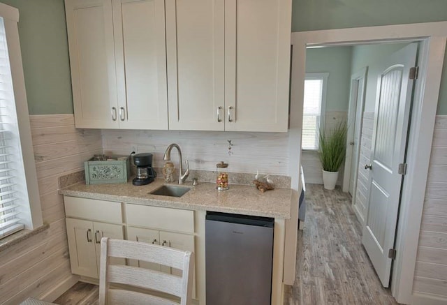 517 Private Road 675, Sargent, TX 77414 - kitchen with white cabinets, fridge, a sink, and light wood-style floors