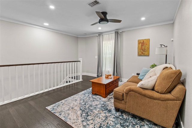 living area with recessed lighting, wood finished floors, ceiling fan, ornamental molding, and baseboards