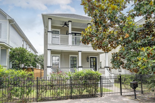 806 Waverly St, Houston, TX 77007 - townhome / multi-family property with a fenced front yard, a balcony, and covered porch