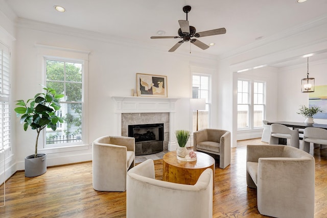 806 Waverly St, Houston, TX 77007 - living area with a tiled fireplace, baseboards, and a wealth of natural light