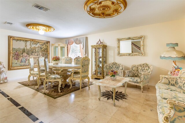 dining area with baseboards and visible vents