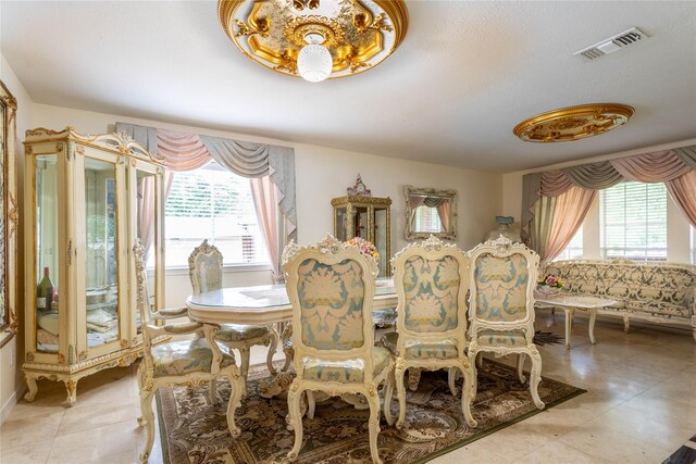 dining room featuring visible vents