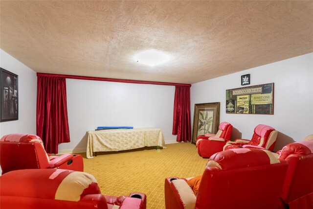 cinema room featuring carpet and a textured ceiling