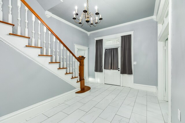 entryway featuring an inviting chandelier, crown molding, marble finish floor, baseboards, and stairway