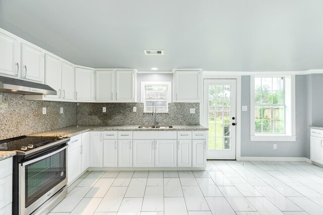 kitchen featuring visible vents, stainless steel electric range oven, a sink, marble finish floor, and under cabinet range hood