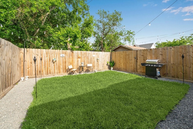 view of yard with a fenced backyard