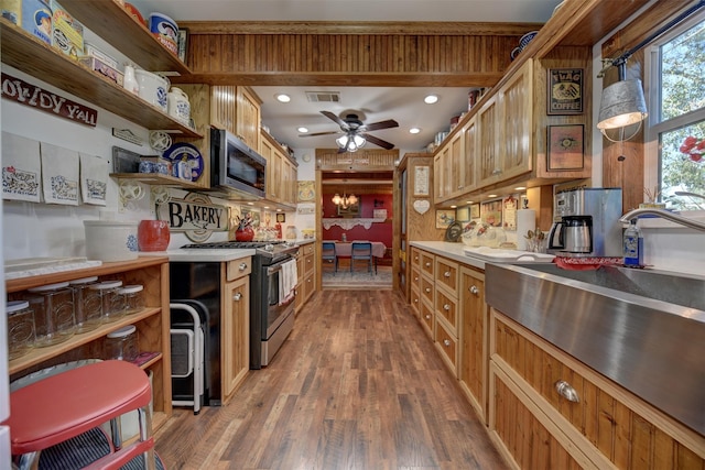 kitchen with ceiling fan, visible vents, appliances with stainless steel finishes, open shelves, and wood finished floors