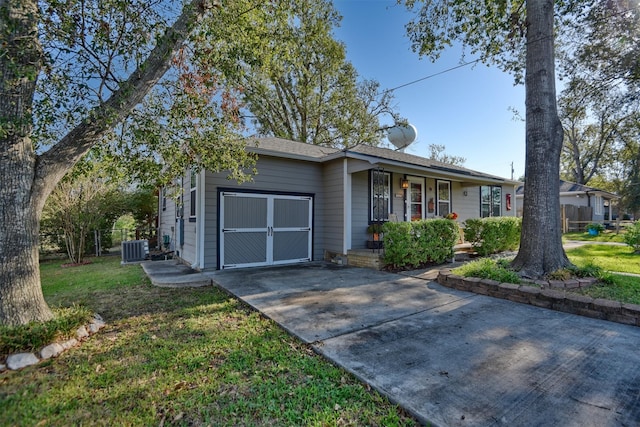 ranch-style house with central air condition unit, fence, and a porch