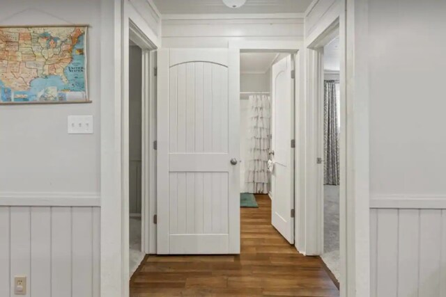 hall with crown molding and wood finished floors