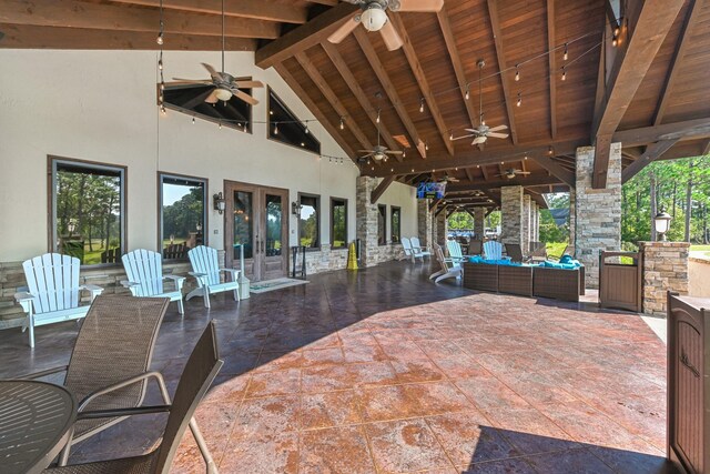 view of patio featuring a ceiling fan, french doors, and an outdoor living space