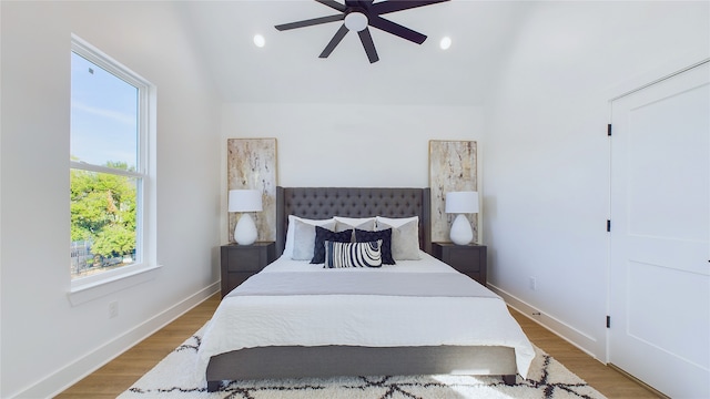 bedroom featuring lofted ceiling, baseboards, ceiling fan, recessed lighting, and light wood finished floors
