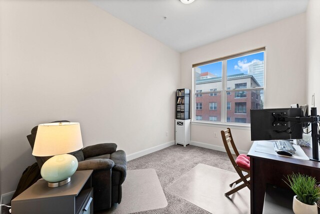 home office featuring carpet flooring and baseboards