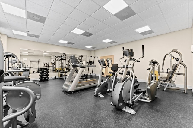exercise room featuring a paneled ceiling