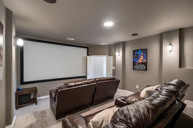 home theater room featuring carpet and baseboards