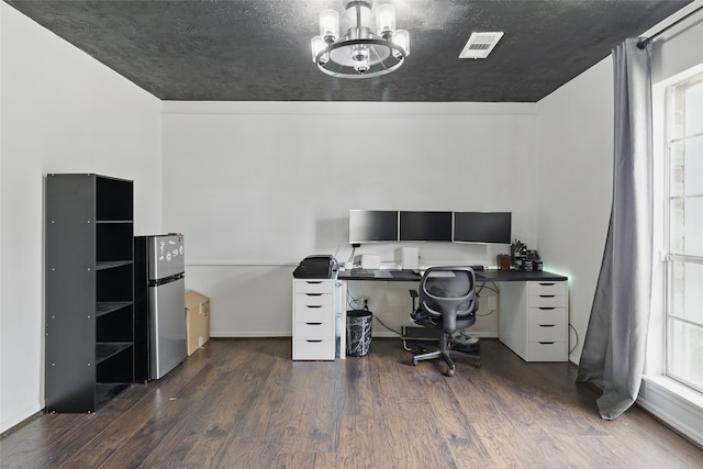 office featuring an inviting chandelier, wood finished floors, and visible vents
