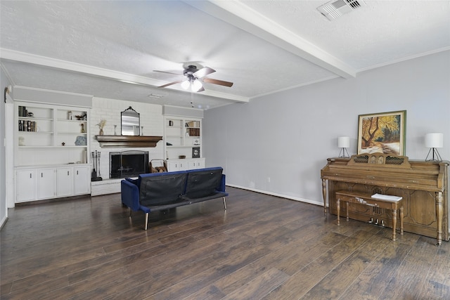 living area featuring ceiling fan, a textured ceiling, visible vents, beam ceiling, and wood finished floors