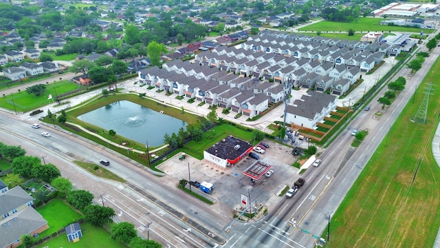bird's eye view with a water view and a residential view