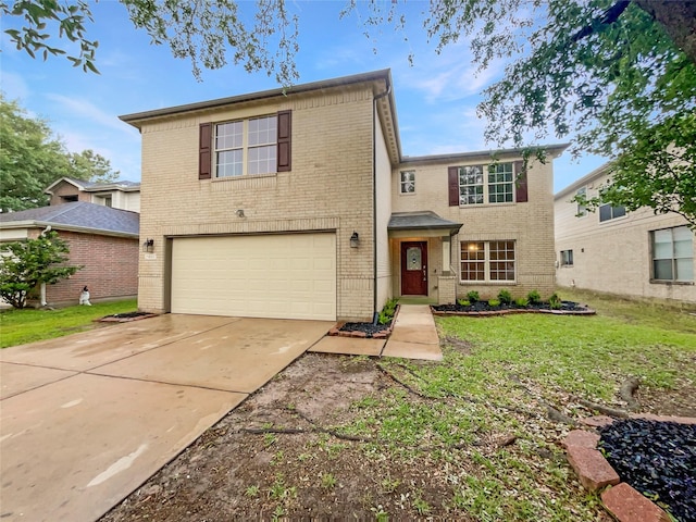 traditional home with brick siding, a garage, a front lawn, and driveway