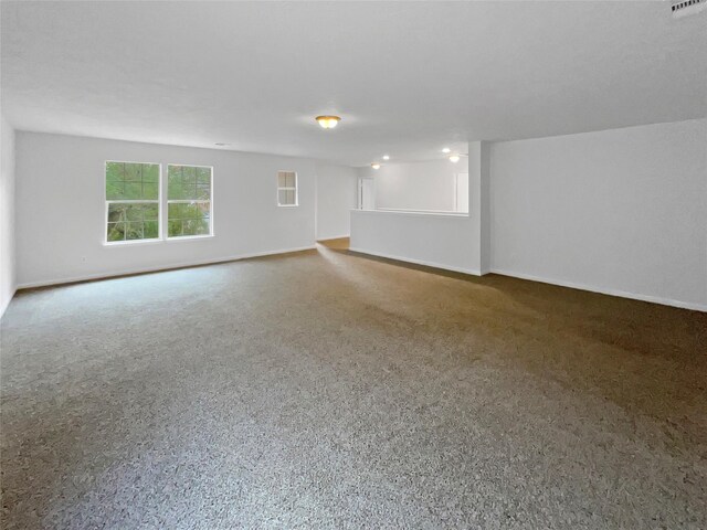 interior space featuring baseboards and visible vents