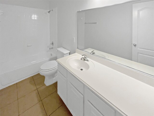 bathroom featuring toilet, shower / bathing tub combination, tile patterned flooring, and vanity
