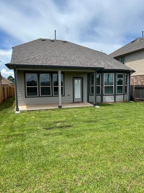 26712 Grandiflora Dr, Magnolia, TX 77355 - rear view of property featuring a shingled roof and a patio
