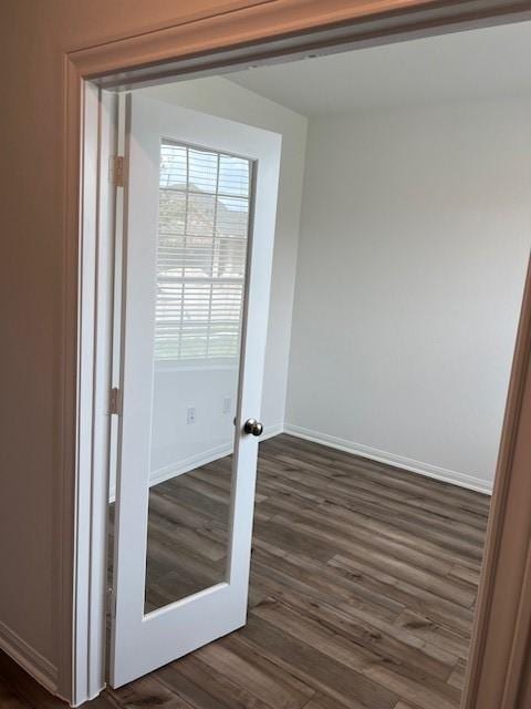 26712 Grandiflora Dr, Magnolia, TX 77355 - doorway with dark wood-type flooring and baseboards