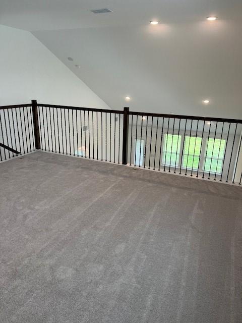 26712 Grandiflora Dr, Magnolia, TX 77355 - carpeted spare room featuring lofted ceiling and recessed lighting