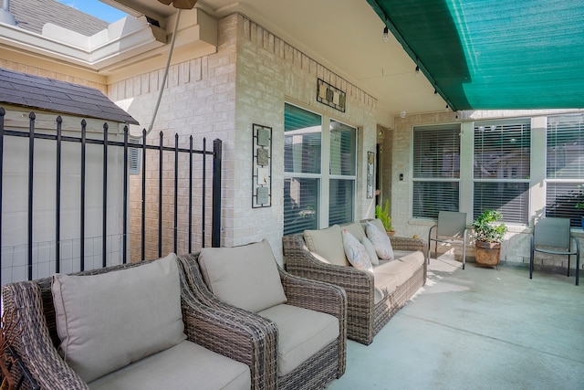 view of patio / terrace featuring fence and outdoor lounge area