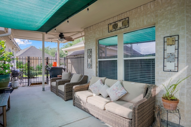 view of patio featuring fence, a ceiling fan, and outdoor lounge area