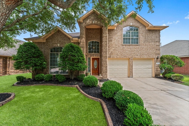 5211 Bur Oak Dr, Pasadena, TX 77505 - traditional-style home with concrete driveway, brick siding, a front yard, and a garage