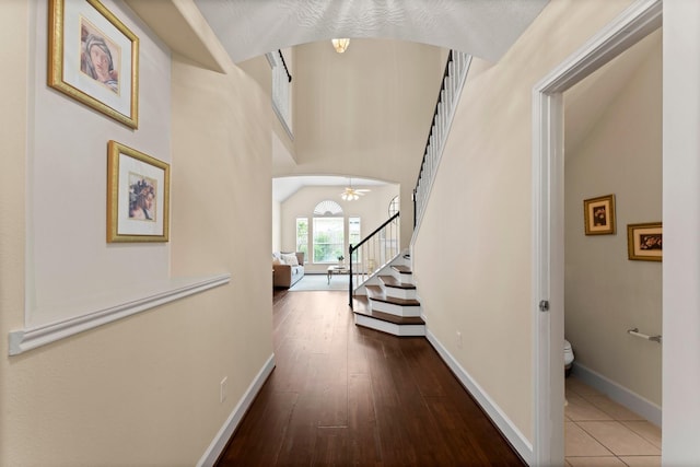 5211 Bur Oak Dr, Pasadena, TX 77505 - hall featuring stairs, baseboards, and hardwood / wood-style flooring