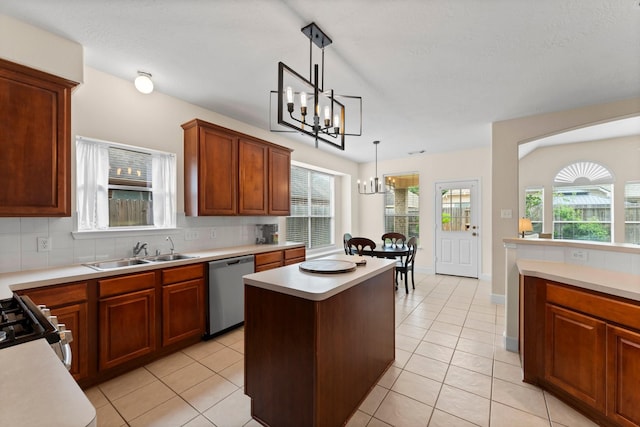 5211 Bur Oak Dr, Pasadena, TX 77505 - kitchen with decorative backsplash, stainless steel dishwasher, a sink, light countertops, and a notable chandelier