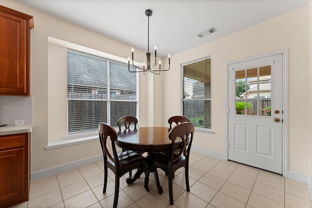 5211 Bur Oak Dr, Pasadena, TX 77505 - dining room with light tile patterned floors, baseboards, visible vents, and a notable chandelier