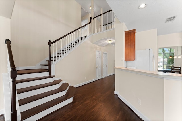 5211 Bur Oak Dr, Pasadena, TX 77505 - stairway featuring a towering ceiling, visible vents, wood finished floors, baseboards, and recessed lighting