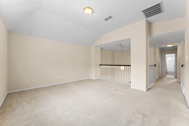 5211 Bur Oak Dr, Pasadena, TX 77505 - interior space featuring baseboards, light carpet, vaulted ceiling, and visible vents