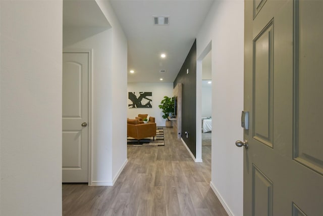 14417 Gray Rocks Rd, Splendora, TX 77372 - hall featuring recessed lighting, baseboards, visible vents, and wood finished floors